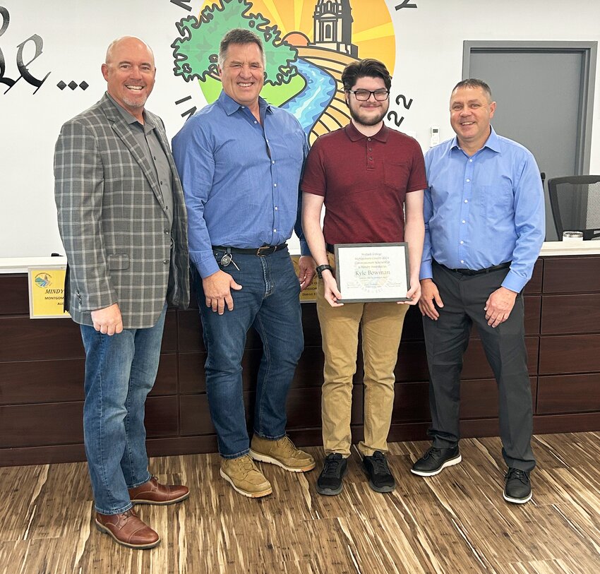 Montgomery County Commissioners, from left Dan Guard and John Frey and Jim Fulwider, far right, pose with Wabash College scholarship recipient Kyle Bowman. The North Montgomery High School student plans to attend the local liberal arts college to study history.