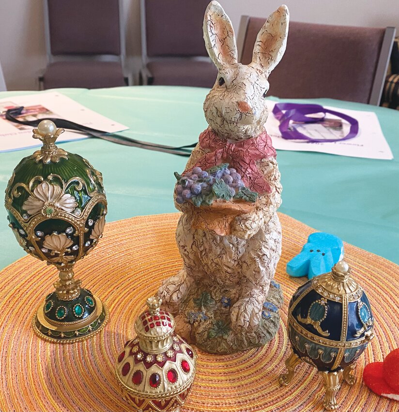 Tables were decorated with Faberge eggs from Ruth Hallett and rabbits from Paula Furr's collection.