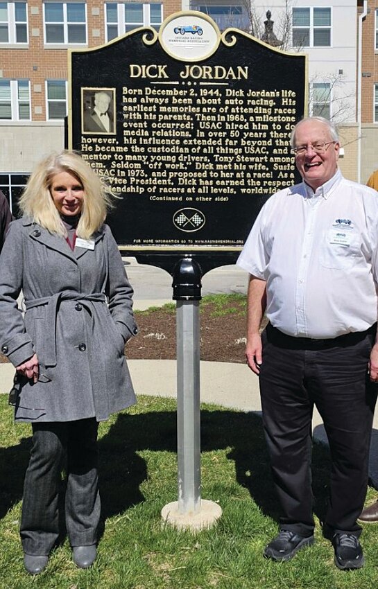 Indiana Racing Memorial Association Co-Founder Mark Eutsler of Linden and Brownsburg Town Manager Debra Cook recently celebrated the completion of the Brownsburg Racing Memorial Trail Phase I with the unveiling of the historic marker honoring the memory of USAC Racing Vice President Dick Jordan &mdash; a 50-year USAC employee &mdash; at the entrance to Arbuckle Commons (7198 Arbuckle Commons). The marker completes the 2.1-mile Phase I of the Brownsburg Racing Memorial Trail, which features five iconic motorsports legends across Williams Park, Town Hall Green, Arbuckle Commons, and White Lick Creek Greenway and includes Linden native and 1982 Indy 500 Co-Rookie of the Year Larry Rice and former Crawfordsville Radio WCVL-AM/WIMC-FM General Manager Howdy Bell, who was also a reporter on the Indianapolis Motor Speedway Radio Network for 42 years. More information about the trail and a map are available at www.brownsburg.org/660/Brownsburg-Racing-Memorial-Trail.