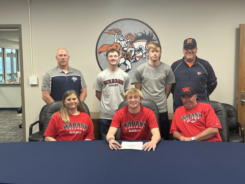 North Montgomery senior Jarrod Kirsch was joined by his family and Charger baseball head coach Matt Voorhees (back left) and pitching coach Joe Swick (back right) on Thursday as Kirsch committed to Wabash College to continue his academic and athletic career.