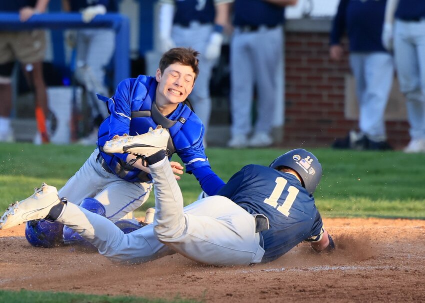 Crawfordsville sophomore catcher Matt Miller applies the tag to a Tri-West runner at home during the Athenians 14-5 win over the Bruins on Wednesday.