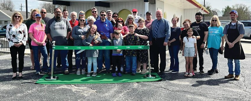 A ribbon cutting ceremony for the new owners of Pizza King, Darrin and Karri Schick, along with Karri&rsquo;s mother, Tascha Walker, was held recently.