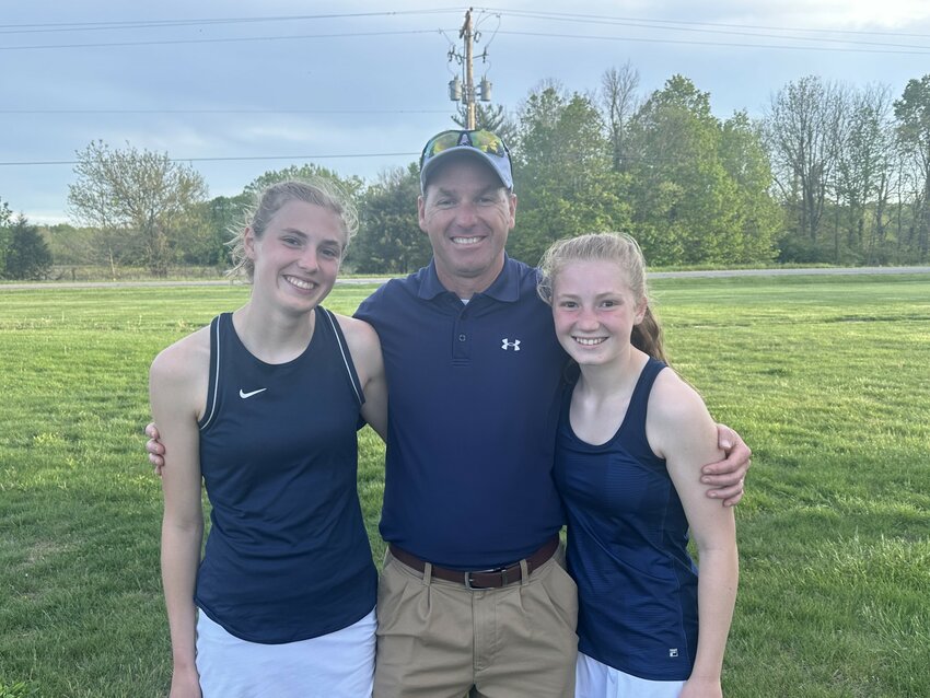 Fountain Central girls assistant coach Chris Webb gets to have the joy of getting to coach both of his daughters as senior Haley Webb (left) and freshman Elise Webb (right) are getting to play for the Mustangs at 1 and 2 singles.
