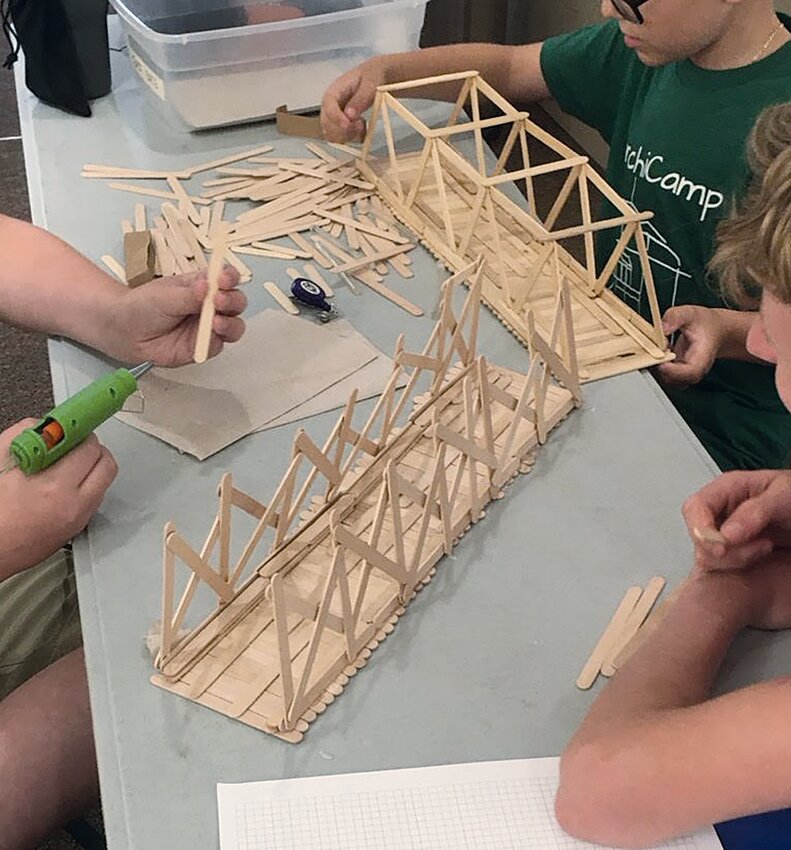 Campers design a popsicle stick bridge during ArchiCamp hosted by the General Lew Wallace Study.