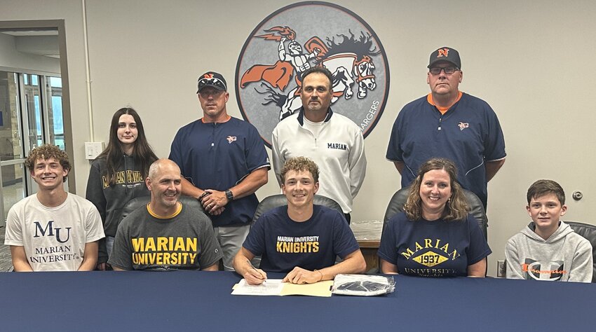North Montgomery senior Roman Utterback officially signed with Marian University to continue his baseball career on Thursday.