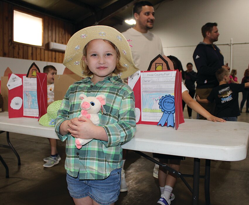 Kindergarten students from Hose Elementary held a County Fair on Friday at the fairgrounds. Students in Amy Hensley’s, Amber Rohr’s and Andrew Swank’s classes exhibited their stuffed animals. The event was organized as part of the students’ unit on the book, “Charlotte’s Web.” Pictured is Penny with her pig.