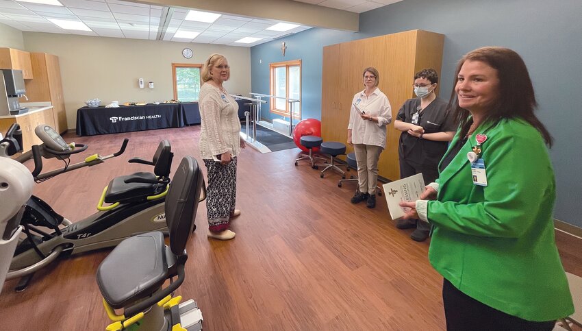Therapy Services Manager Dusti Chase, far right, gives a tour of the new outpatient therapy facility on Friday.