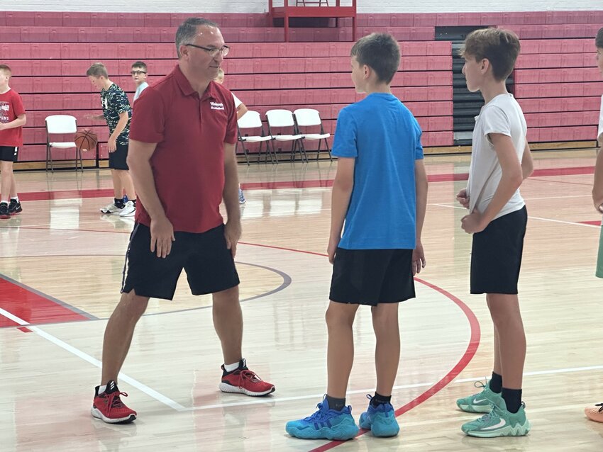 Wabash College Men’s Basketball coach Kyle Brumett speaks to campers during a drill as part of the week-long skills camp that he and the Little Giants put on every summer.