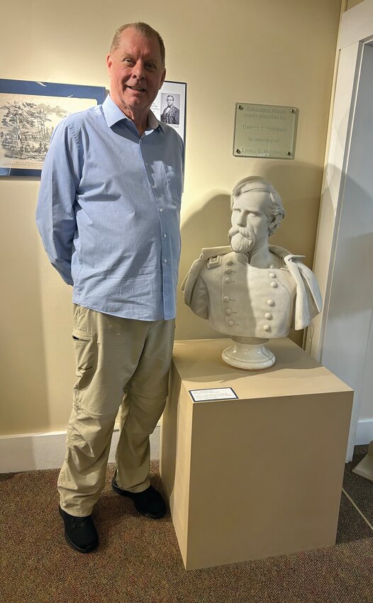 Crawfordsville native Michael E. Fox recently published &ldquo;Lew, The Life and Times of the Author of Ben Hur.&rdquo; He is pictured during a recent book-signing event with a bust of Gen. Lew Wallace which is on display at the Gen. Lew Wallace Study and Museum.
