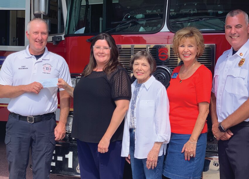 Dorothy Q Chapter of the National Society of Daughters of American Revolution gave a donation to the Crawfordsville Fire Department to sponsor 100 children of needed materials for the “Fire Safety Education Program.” In cooperation with the area schools, this program will assist CFD in teaching children fire safety and burn prevention. Pictured, from left, are Crawfordsville Fire Chief Scott Busenbark; Chapter Regent Ericia Church; Past Treasurer Rachel Brown; Vice Regent Michele Borden; and Deputy Chief Paul Miller.