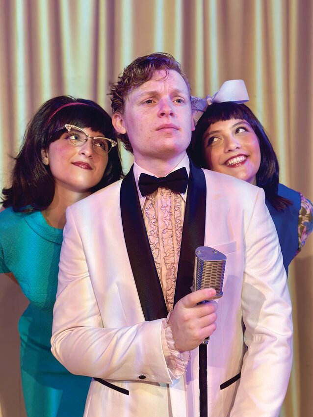 Best friends Marge Gelman (Rae Squillante, left) and Lois Warner (Madison Meeron, right) share the spotlight on stage with resort singer Del Delmonaco (Jack Preston Issler, center).