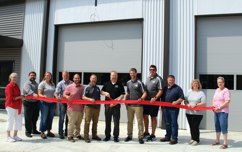 Attending the Parke Heritage High School automotive technology facility ribbon cutting ceremony were Lisa Wood, Chamber of Commerce member from Sentinel; Stuart Godfrey, krM Architecture; Greg Kempf, Strode Construction; Josh Edwards, krM Architecture; Corey Newnum, auto tech instructor; Mike Schimpf, superintendent of NCP Schools; Ed Kutch, auto tech instructor; Bruce Patton, PHHS principal; Craig Newby, director of Wabash River Career and Technical Education; Heather Thompson, executive director of the Chamber of Commerce; and Kandee Cook, Chamber of Commerce member from WAXI Radio.