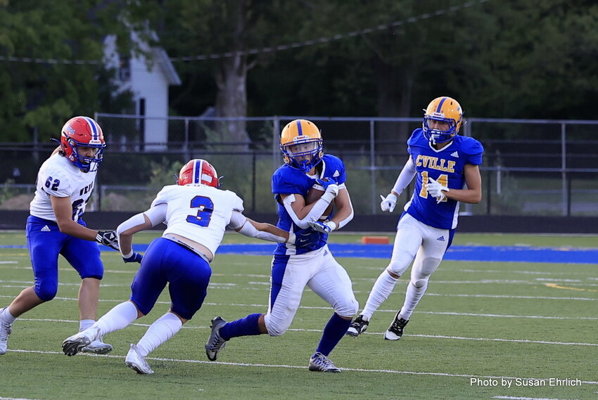 Danny Surface runs with the ball against Western Boone on Friday. The Athenians fell to the Stars 41-0.