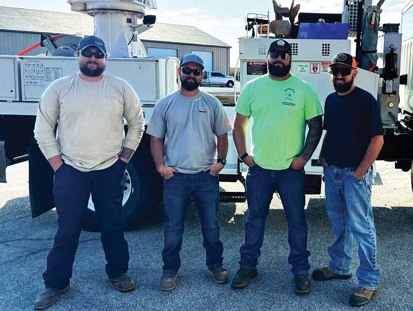 Tipmont lineworkers departing from Tipmont's Linden headquarters are Christian Guimond, Adam Crabb, Matt Bassett and Jason Phillips.