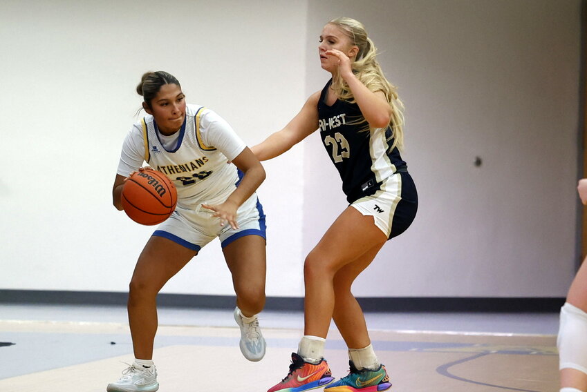 Athenians Caroline Melavage, top left, Aurbey Lowe, bottom left, and Litzy Huesca, above, battle Thursday against Tri-West at home. The Bruins cruised to a 58-31 victory. CHS looks to break its three-game losing streak on Tuesday when they host Fountain Central. Game time is 7:30 p.m.