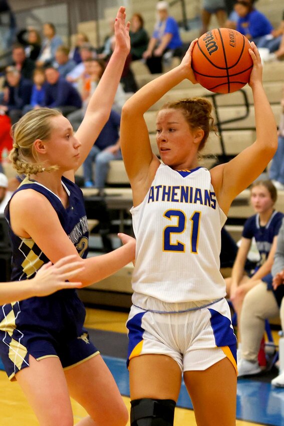 Celeste Moore of Crawfordsville looks to pass over Bella Bacon of Fountain Central.
