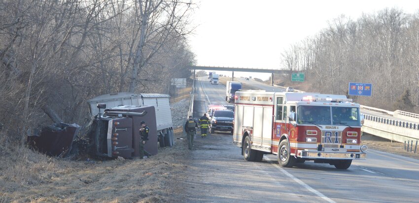A Rushville man escaped serious injury Monday afternoon when his semi tractor-trailer crashed near the 34 mile-marker of eastbound Interstate 74. According to police, Collie Foust, 39, was driving a 1990 semi and grain trailer when it went off the roadway and overturned. The semi was hauling 80,000 pounds of grain. A nearby guardrail and bridge deck were damaged   during the crash.