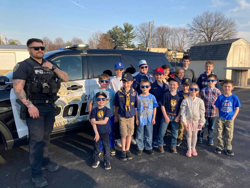 Officer Kamden Hoycus of the Crawfordsville Police Department recently visited Cub Scout Pack 909 during their meeting at the American Legion. The pack enjoyed learning about careers in law enforcement, training requirements, duties of police officers and police gear and its uses. Each Cub Scout was able to check out Officer Hoycus&rsquo; SWAT gear, Stop-Sticks, and were given a tour of his 2022 Police Interceptor. During the tour, each Cub was familiarized with the emergency lights and different siren tones. The Cubs were all sent home with Honorary Police &ldquo;sticker-badges&rdquo; and CPD shades!