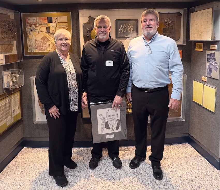 Linden High School&rsquo;s Daryl Warren, center, was indicted into the Indiana Basketball Hall of Fame on Wednesday. Several family members and community fans attended the induction. He is pictured with his sister, Deanna Dilling, and brother Curt Warren. Visit our archives at https://www.journalreview.com/stories/call-from-the-hall,321569? to learn more about Warren&rsquo;s basketball career and his reaction after receiving the &ldquo;Call from the Hall.&rdquo;