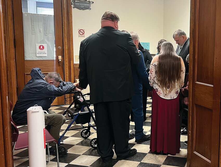 Timothy Florence, far right, and his family gather Thursday outside Montgomery Circuit Court while a jury deliberates his fate.