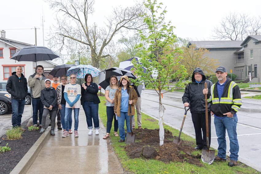 Crawfordsville Main Street celebrated Arbor Day by collaborating with Montgomery County Soil and Water Conservation District, Indiana American Water and Crawfordsville Street Department to plant three new trees on Pike Street in downtown Crawfordsville on Friday. The plants, two Sugar Maples and a Red Maple, replaced three harmful and invasive trees ­— Callery Pears. Pictured are members from each collaborating organization along with Mayor Todd Barton.