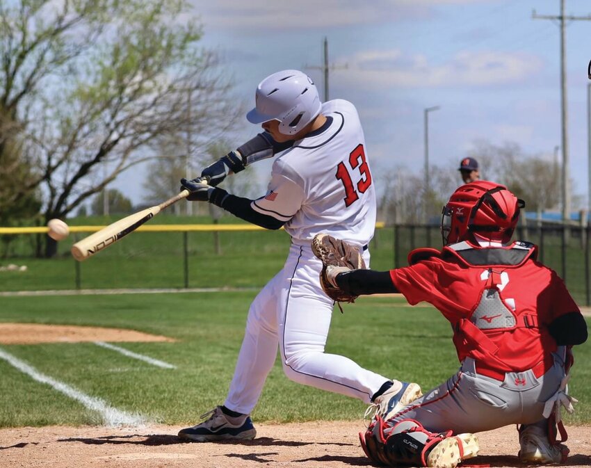 North's Cayden Keller swings at a pitch. Also pictures is South catcher Colton Cory.