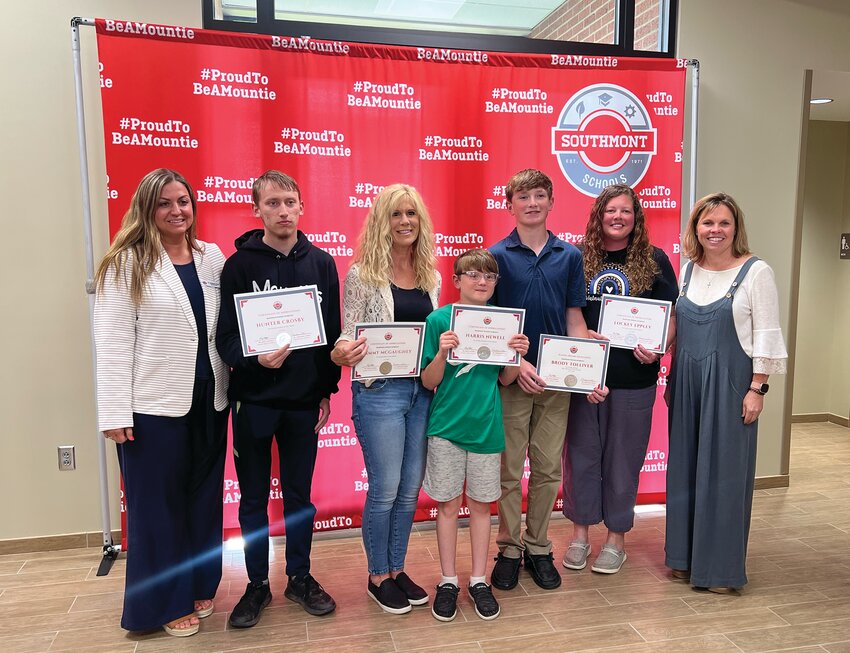 Southmont's Superintendent Dr. Stephanie Hofer and board president Julie Hess pose with students and staff of the month on Monday.