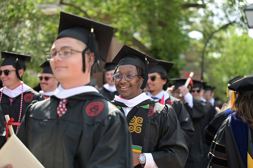 Keane Albright (center) was one of the 186 members of the of the Class of 2025 to graduate Saturday at Wabash College’s Commencement exercises in Little Giant Stadium on campus in Crawfordsville.