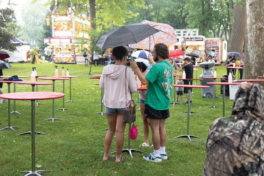 Rain can't keep the faithful festival-goers away. The 51st annual Crawfordsville Strawberry Festival continues through Sunday on the grounds of Lane Place.