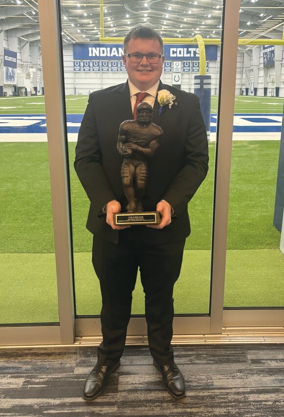 Two Montgomery County graduates were recently honored as scholar athletes by the Central Indiana National Football Foundation. Southmont&rsquo;s Cole Rhoads and North Montgomery&rsquo;s Jayden Thompson, who is pictured with his father, Coach Josh Thompson. The student-athletes were honored at a celebration held in April at the Colts Complex Practice Facility. A total of 19 football players from Central Indiana were honored for academic excellence and leadership. The NFF promotes developing leadership, sportsmanship, competitive zeal and drive for academic success.