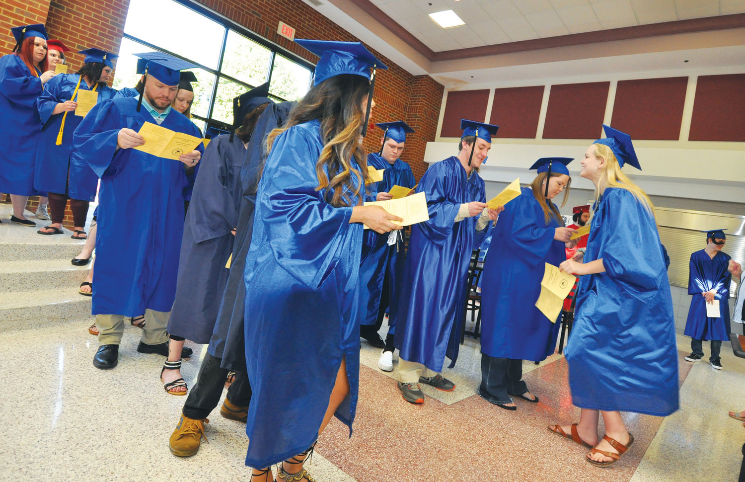 Graduates of this year's Crawfordsville Adult Resource Academy line up prior to Thursday's graduation ceremony at Crawfordsville High School.