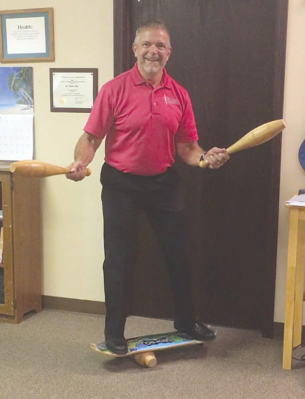 Dr. John Bottorff displays his balancing skills.