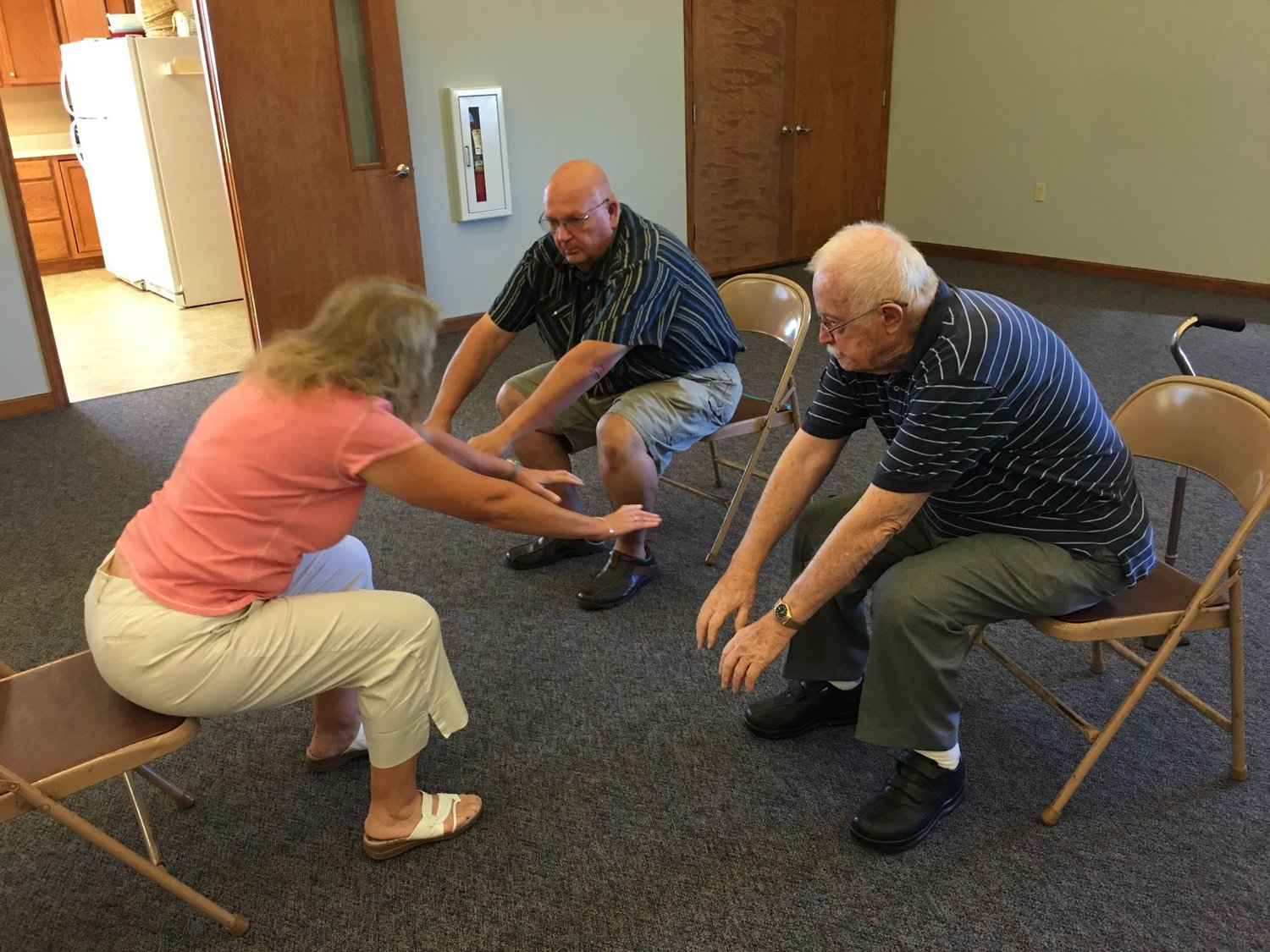 Linda Himes leads Parkinson’s disease patients through a series of exercises to help improve balance, coordination and agility during a recent meeting of CLIMB. 