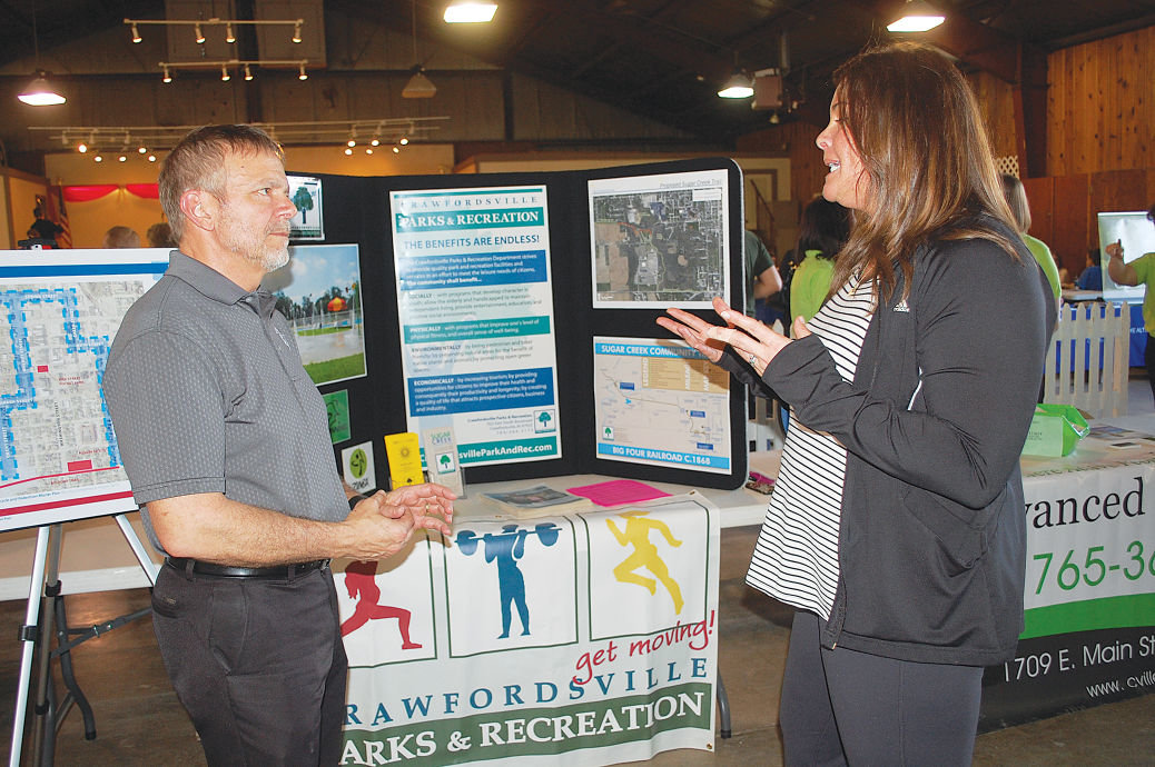 Dr. John Bottorff of Advanced Chiropratic and Crawfordsville Park and Recreation Director Fawn Johnson manned their organization's booth at Tuesday's Montgomery County Health Summit.