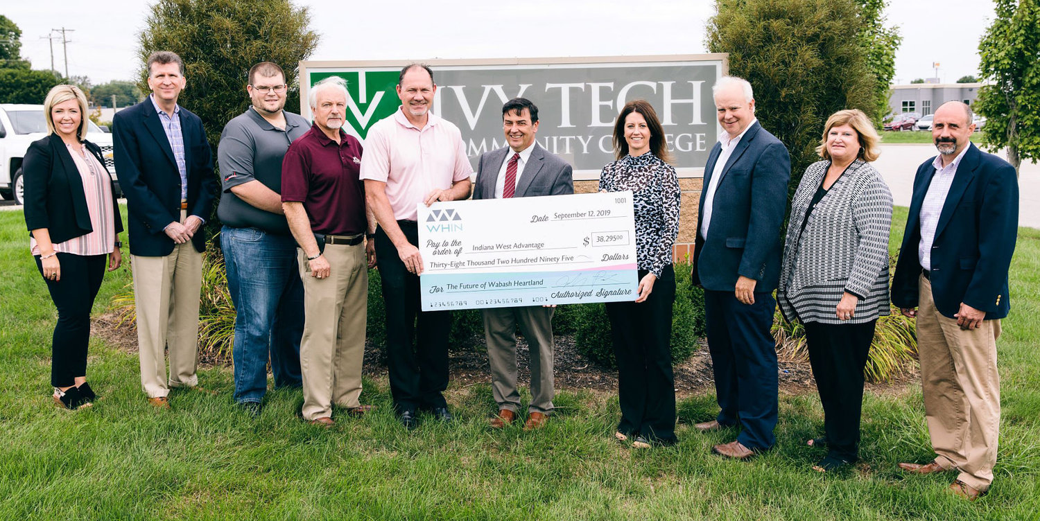 Members from IWA, Ivy Tech Community College Lafayette, Bane-Welker and Co-Alliance accept a check from the Wabash Heartland Innovation Network. Pictured, from left, are Andrea Schwartz, Ivy Tech Community College; Dr. Todd Roswarski, Ivy Tech Community College; Tyler Wilson, Bane-Welker; Greg Morrison, Davis Morrison Realty; Brad Monts, Hoosier Heartland State Bank; Dr. David Bathe, Ivy Tech Community College; Stephanie Merrill, Ivy Tech Community College; Jeff Griffeth, Co-Alliance; Dr. Colleen Moran, North Montgomery Schools; Kraig Bowers, Ivy Tech Community College.