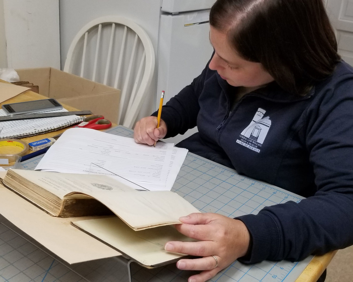 Associate director Amanda McGuire of the Gen. Lew Wallace Study and Museum works on book conservation.