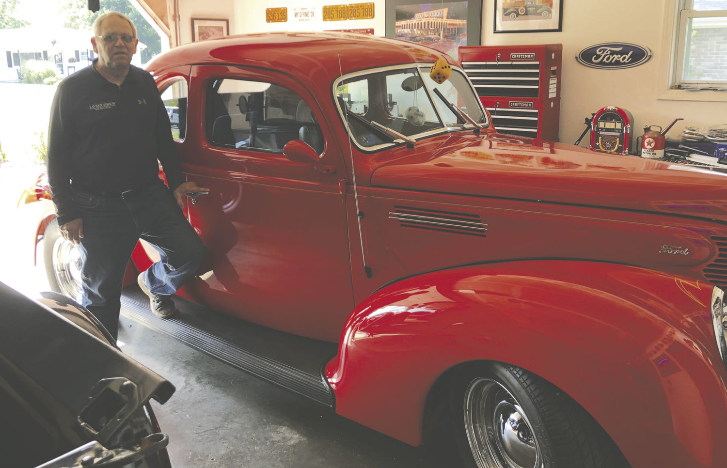 Ed Stuffle stands with his 1939 Ford Coupe.