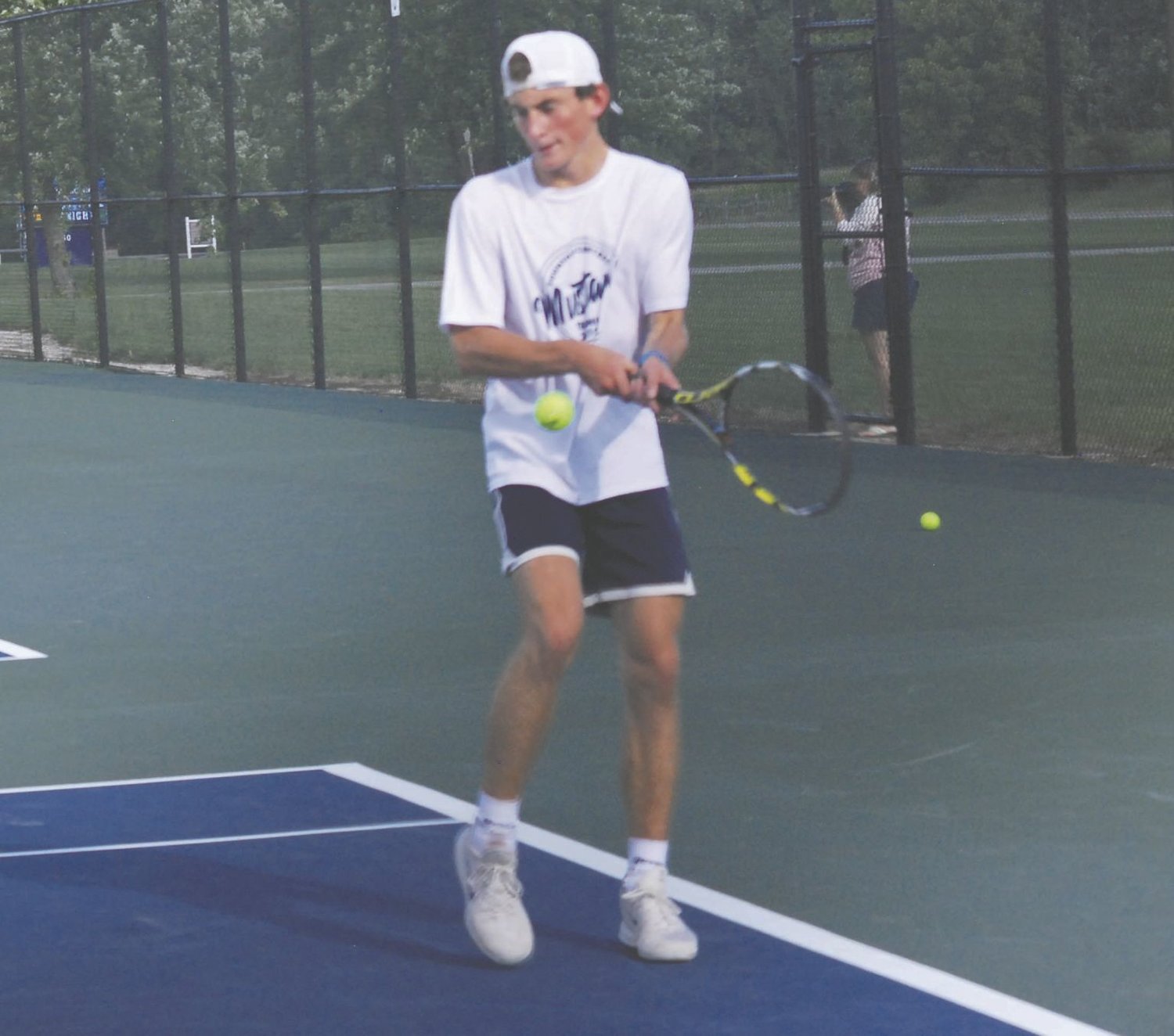 Fountain Central's Carson Eberly returns a ball against North Montgomery's Jakob Kirsch at No. 1 singles Tuesday night.