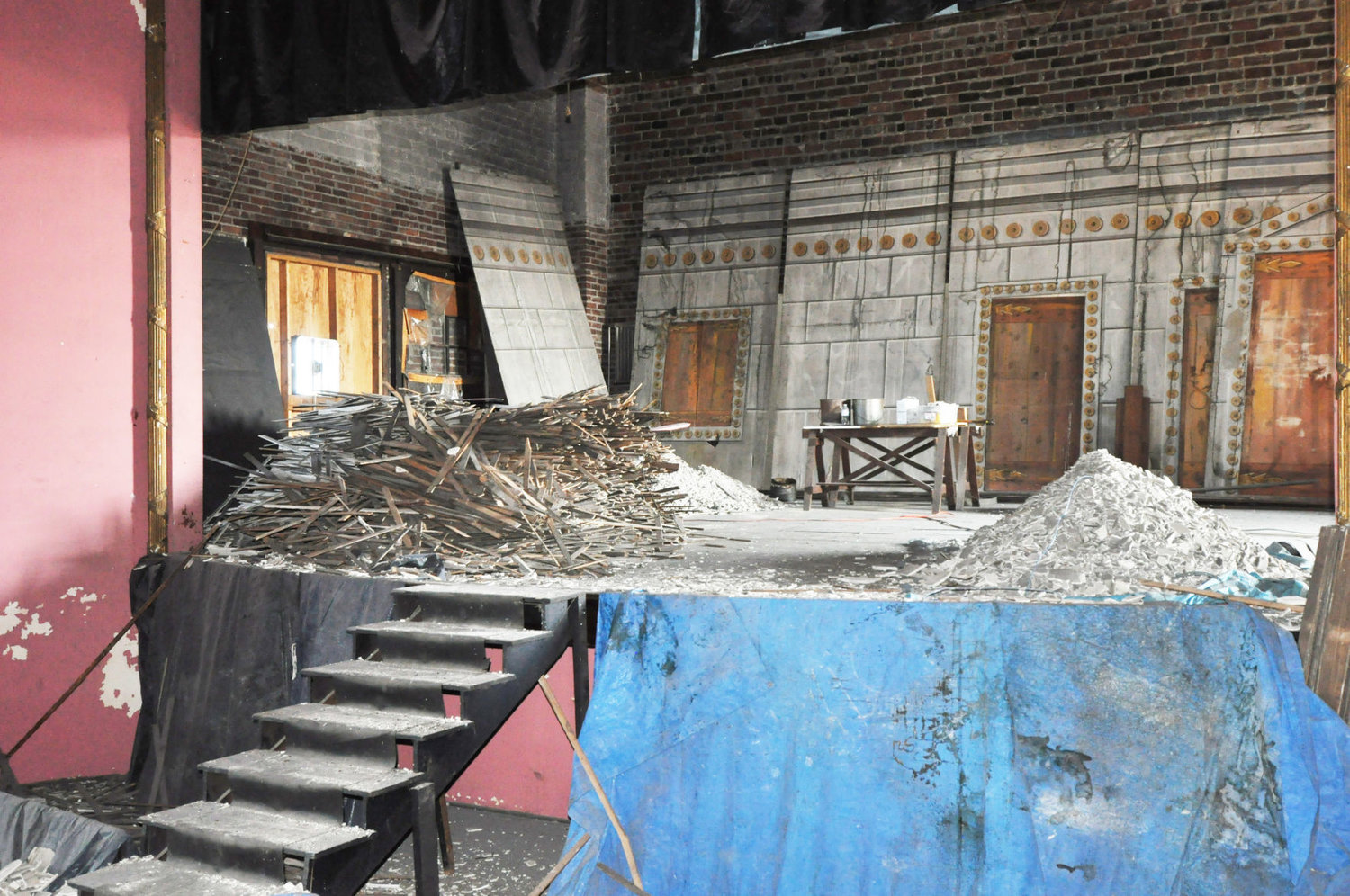 Piles of plaster and building material cover the stage of the Masonic Temple theater Wednesday. The temple is being restored by a non-profit preservation group.