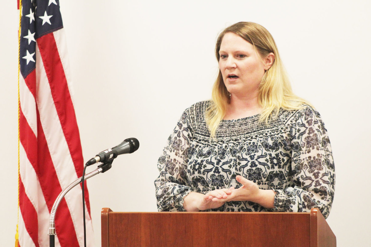 Women in Network co-chair Summer Ervin speaks Monday at the kickoff celebration for the women's suffrage centennial at the Crawfordsville District Public Library.