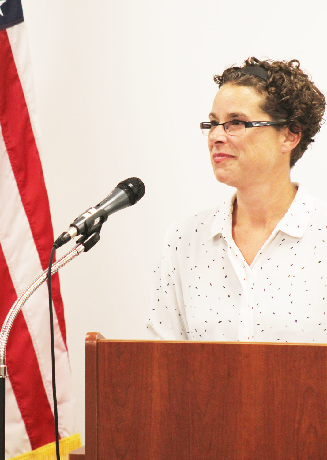 Pace Dairy site leader Tracy Mobley speaks Monday at the kickoff celebration for the women's suffrage centennial at the Crawfordsville District Public Library.