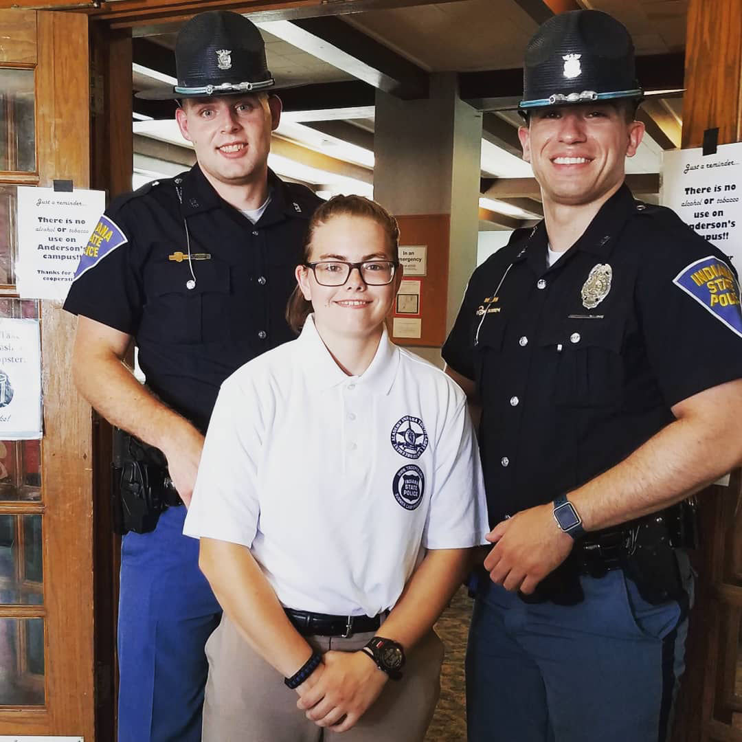 Leah Rusk stands with Indiana State Police Troopers Corey Brown and William Carlson at the Indiana Youth Cadet Law Enforcement Academy at Anderson University in July. Rusk learned about the camp through the Montgomery County Youth Service Bureau's Juvenile Mentoring Program.