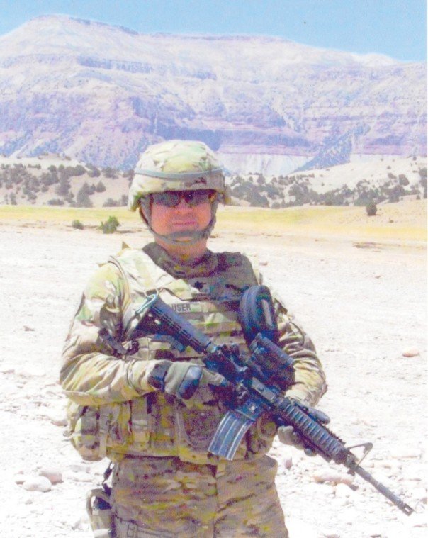 ARMY LT. COL. TOM HAUSER stands in western Afghanistan in July
while participating in combat patrols.