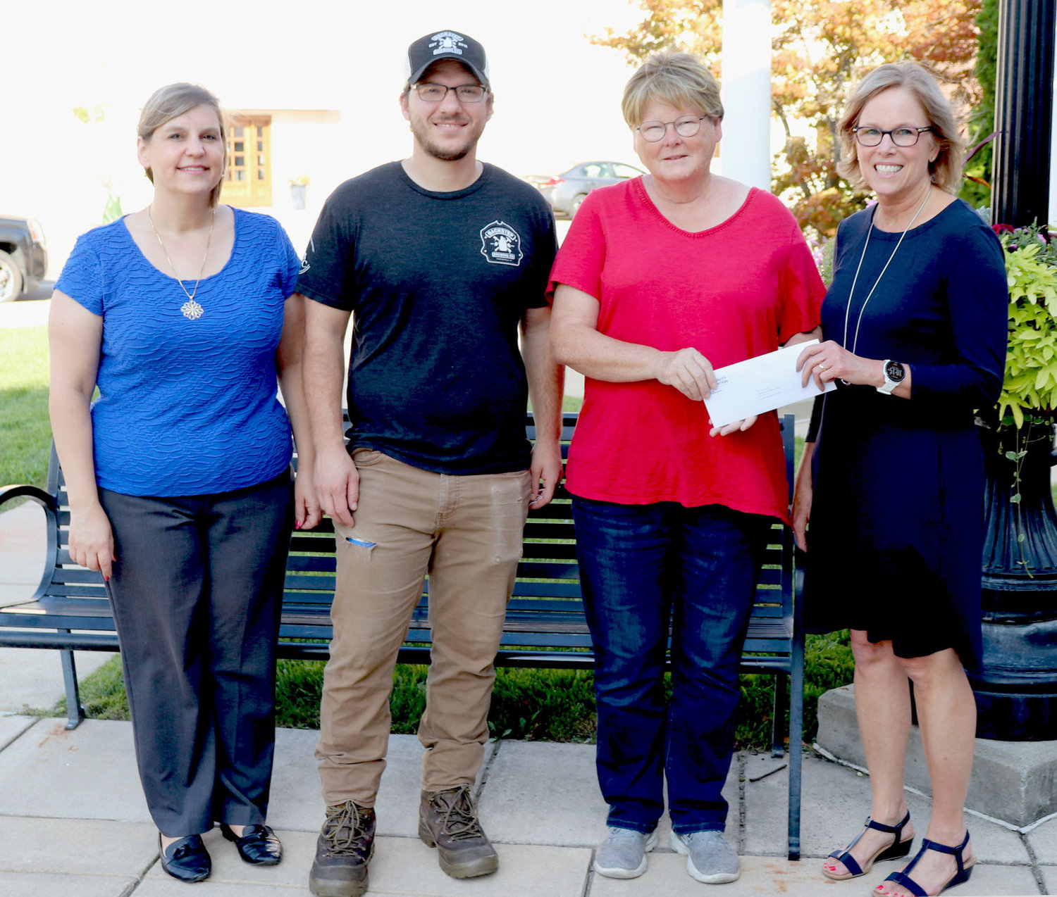 Crawfordsville Main Street program manager Sue Lucas, along with Josh Miller, Backstep Brewing and Jodi Wilson representing the Crawfordsville District Public Library accepts a $1,000 MCCF Love Note Grant from Cheryl Keim, grants coordinator.