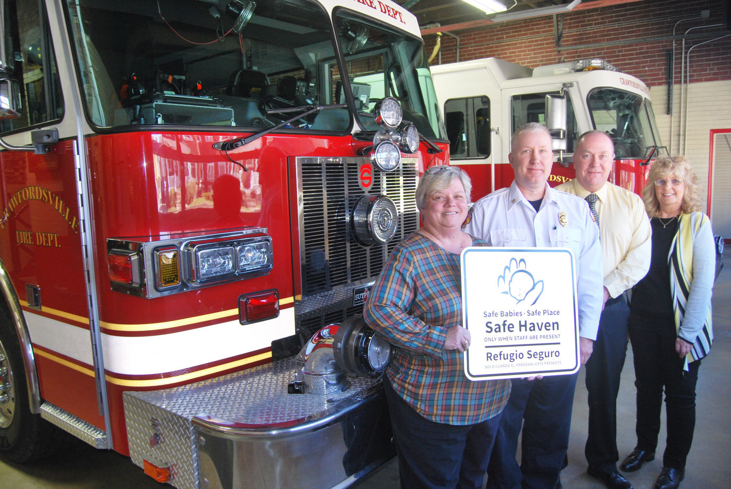 The Crawfordsville Fire/EMS Department received equipment and training on the state's Safe Haven law, which allows people to relinquish unharmed babies to firehouses and other designated sites. Montgomery County Youth Service Bureau sponsored the training and supplies. Pictured from left are YSB executive director Karen Branch, Crawfordsville Fire Chief Scott Busenbark, Mayor Todd Barton and National Safe Haven Alliance representative Denise Maxwell.