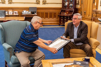 Whiting native Ed Lampa, left, receives the Sagamore of the Wabash award from Gov. Eric Holcomb Oct. 21 in the governor's Statehouse office in recognition of Lampa's 33 years of state government service, including operating the teleprompter during the annual "State of the State" address for Indiana's three most recent governors.