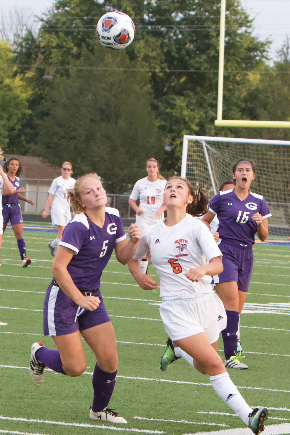 North Montgomery's Teegan Bacon fights for the ball with Greencastle's Elise Lausee.