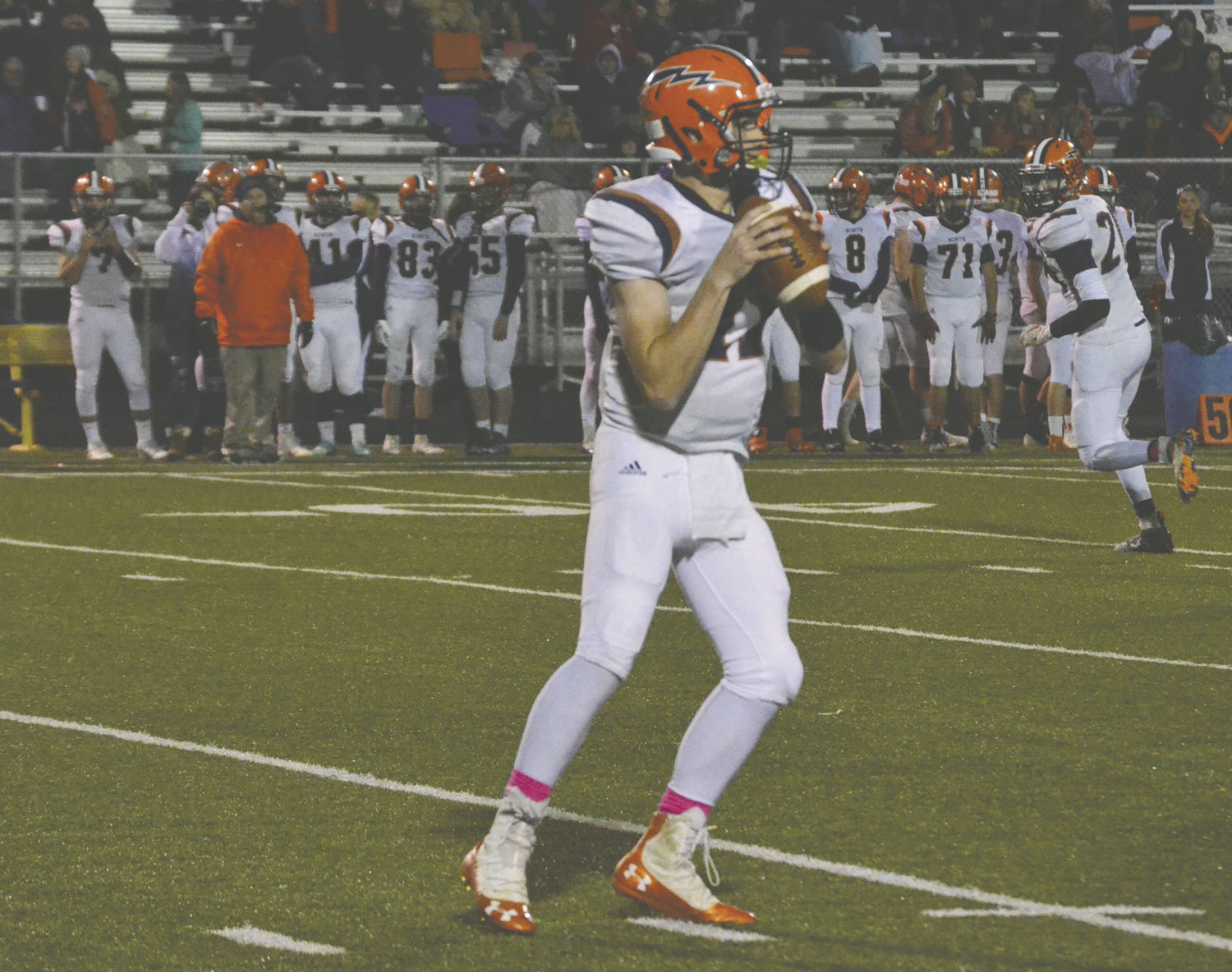 North Montgomery senior quarterback looks down field in the Chargers' sectional win over Crawfordsville.