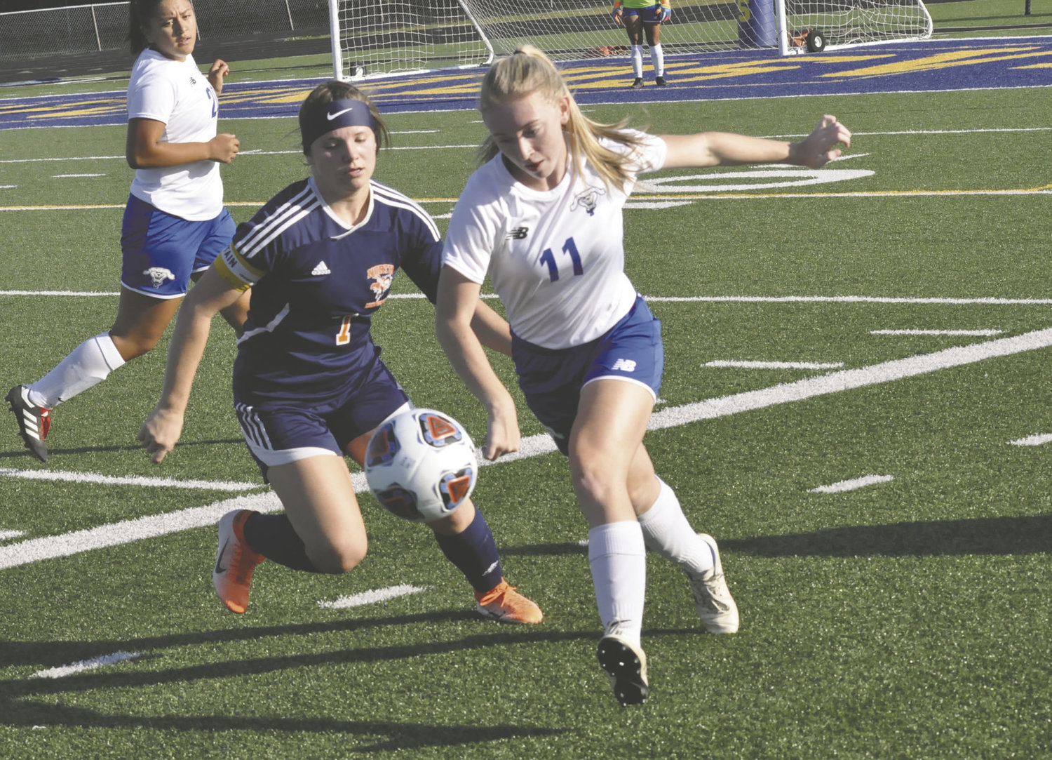 North Montgomery's Sidney Campbell battles with Frankfort' Peyton Myers. Campbell scored the Charger's first goal in a 3-1 win over the Hot Dogs.