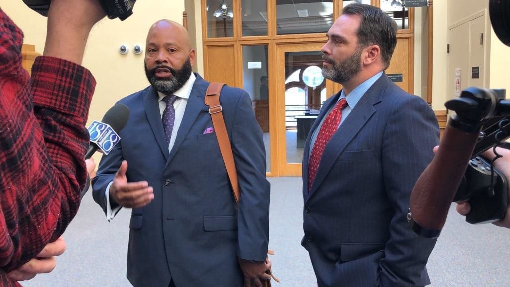 Michael Barnett's (right) attorney, Terrance Kinnard (left), speaks to media after a hearing Wednesday morning. The judge granted the gag order during Monday's hearing.